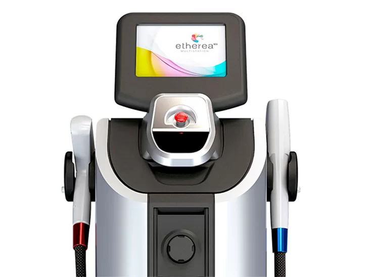 Nessa imagem, podemos ver um aparelho tecnológico branco e preto. No topo, há um painel com bordas pretas escrito etherea e um botão vermelho abaixo do painel. Nas laterais podemos ver duas hastes, uma vermelha e uma azul.
